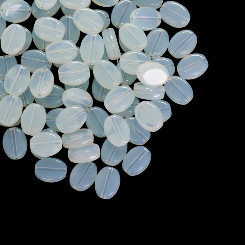 Koralik szklany 11x8 mm owalny płaski podobnego do kamień księżycowy przezroczysty 1 szt