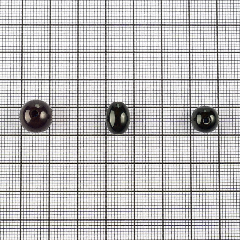 Koralik plastikowy imitujące kocie oko 8x12 mm czarny 1 szt
