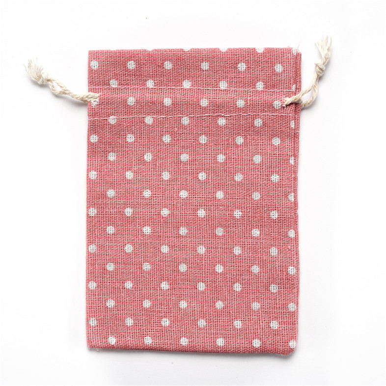 Decorative jute bag 14×10 cm pink with polka dots