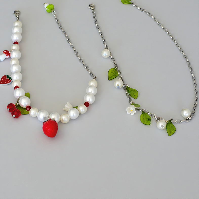 Bracelets (pair) made of glass beads and plastic pendants for legs No. 3